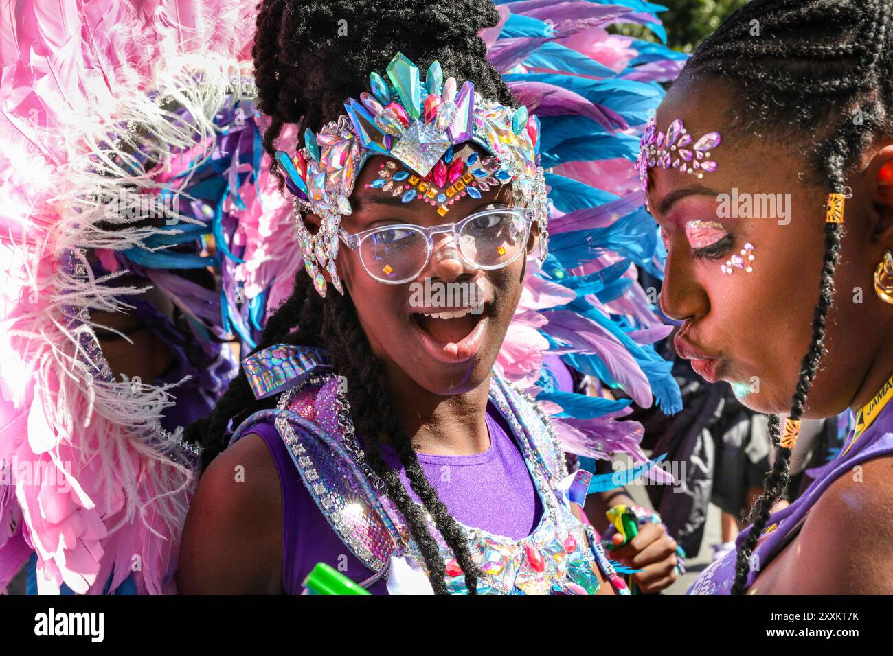 London, UK. 25th Aug, 2024. The 'Caribbean Sessions' participants, including many children, dance behind their float. Notting Hill Carnival Sunday starts with the traditional Children's Carnival and a family orientated carnival parade. Revellers celebrate this Bank Holiday Weekend participating or watching along the carnival route, at sounds systems, stalls and venues on the first of two days of Notting Hill Carnival festivities. Credit: Imageplotter/Alamy Live News Stock Photo