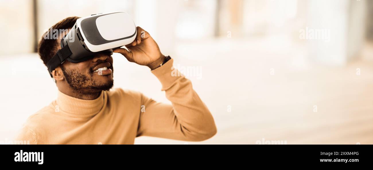 Afro manager wearing augmented reality goggles at office Stock Photo