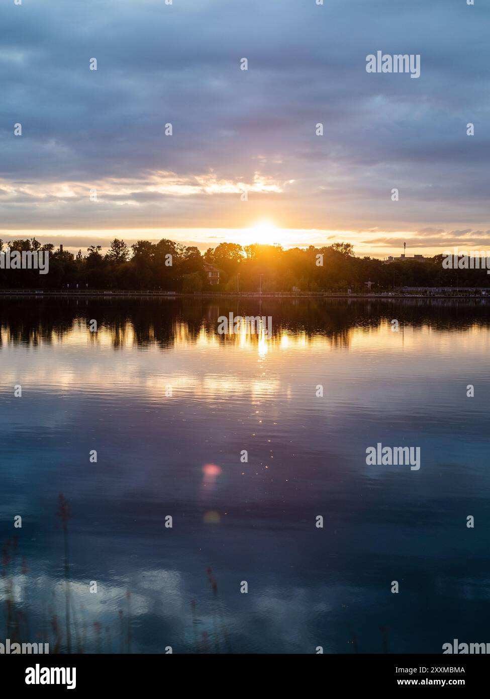 cold blue summer sunset over pond in Kaliningrad city, Russia Stock Photo