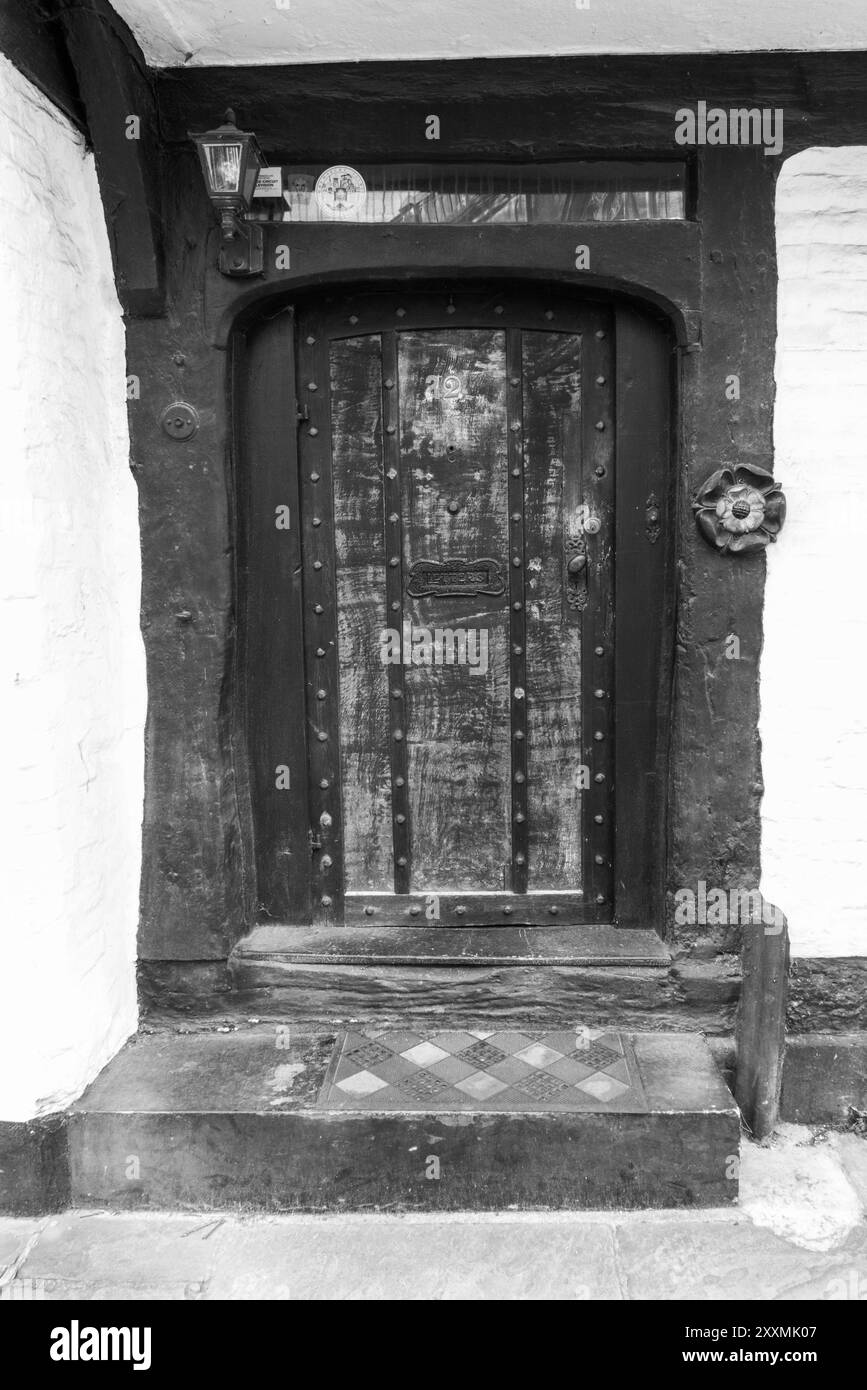 Doorway entrance to timbered building with Tudor Rose on righthand door Jamb, Shrewsbury England UK March 2024 Stock Photo