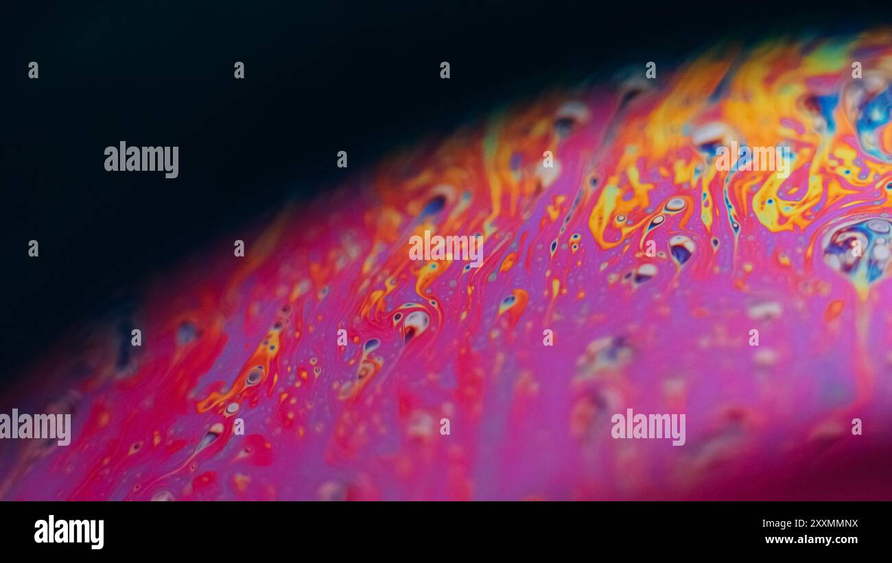 Ink rainbow. Psychedelic spectrum. Defocused pink yellow blue color ...