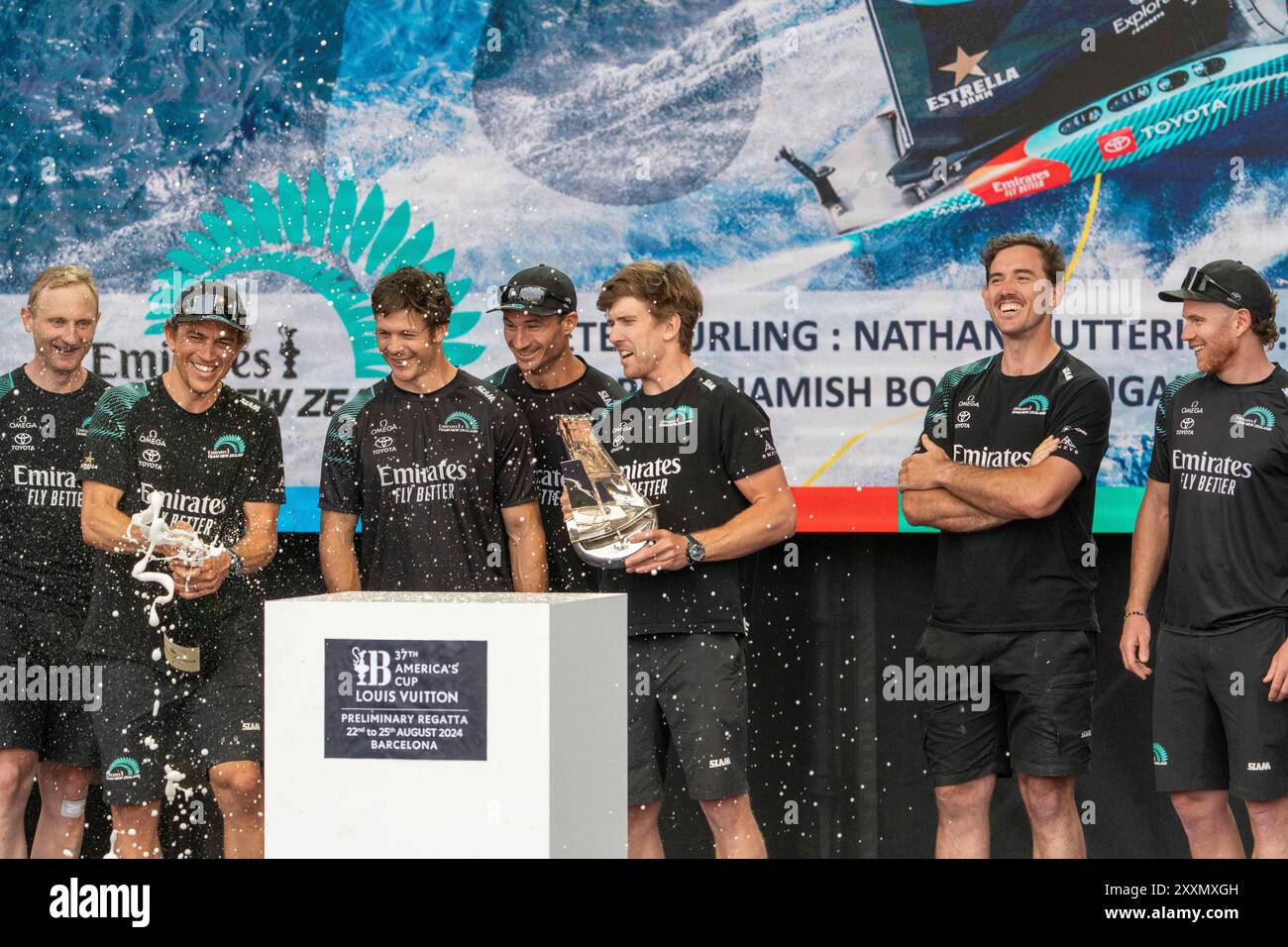 The New Zealand team wins the trophy of the preliminary regatta, marking the beginning of the 37th America's Cup, which will be held in Barcelona until mid-October. El equipo de Nueva Zelanda gana el trofeo de la regata preliminar, en lo que ha sido el inicio de la 37&#xaa; Copa América, que se celebrará en Barcelona hasta mediados de octubre. in the pic:DOUGAL ALLAN, HAMISH BOND, PETER BURLING, LOUIS CROSBY, RAY DAVIES, ASH DRAPER, MARCUS HANSEN, JOSH JUNIOR, ANDY MALONEY, SAM MEECH, NATHAN OUTTERIDGE, KIM SIMPERINGHAM, LOUIS SINCLAIR, BLAIR TUKE, MARIUS VAN DER POL, SIMON VAN VELTHOOVEN, CA Stock Photo