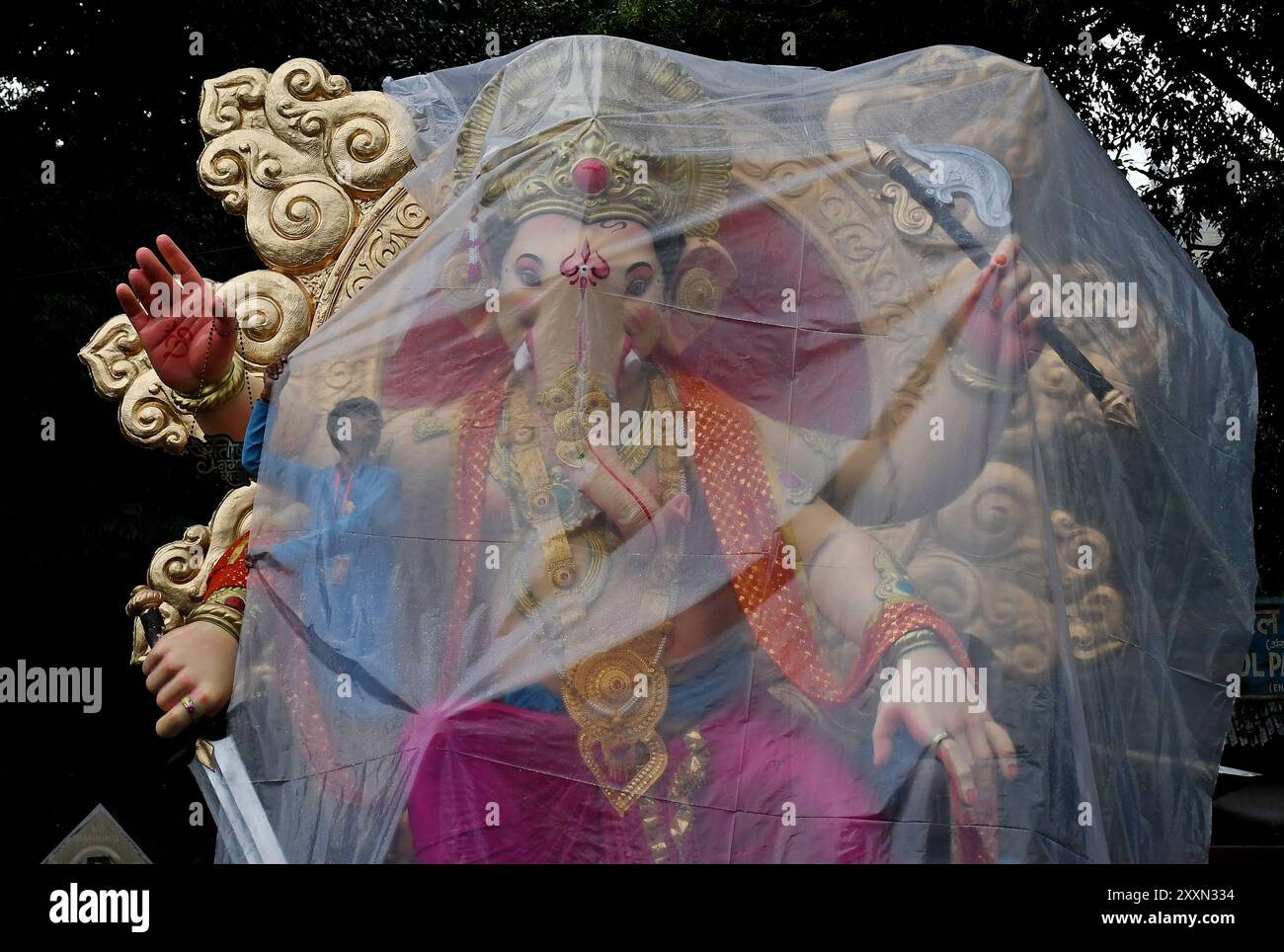 idol-of-elephant-headed-hindu-god-ganesh-covered-in-plastic-sheet-to