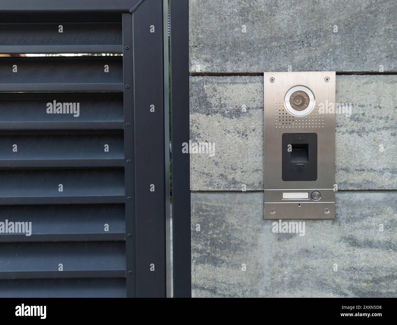 Stainless Steel Intercom on Concrete Wall Stock Photo