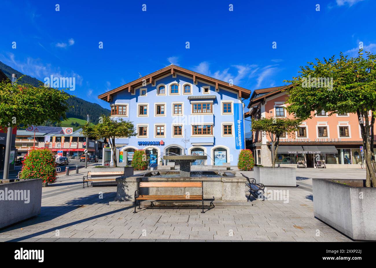 Colourful Sparkasse savings bank and shops in the main square in Mittersill, a village in the Pinzgau region of the Alps, Austria Stock Photo