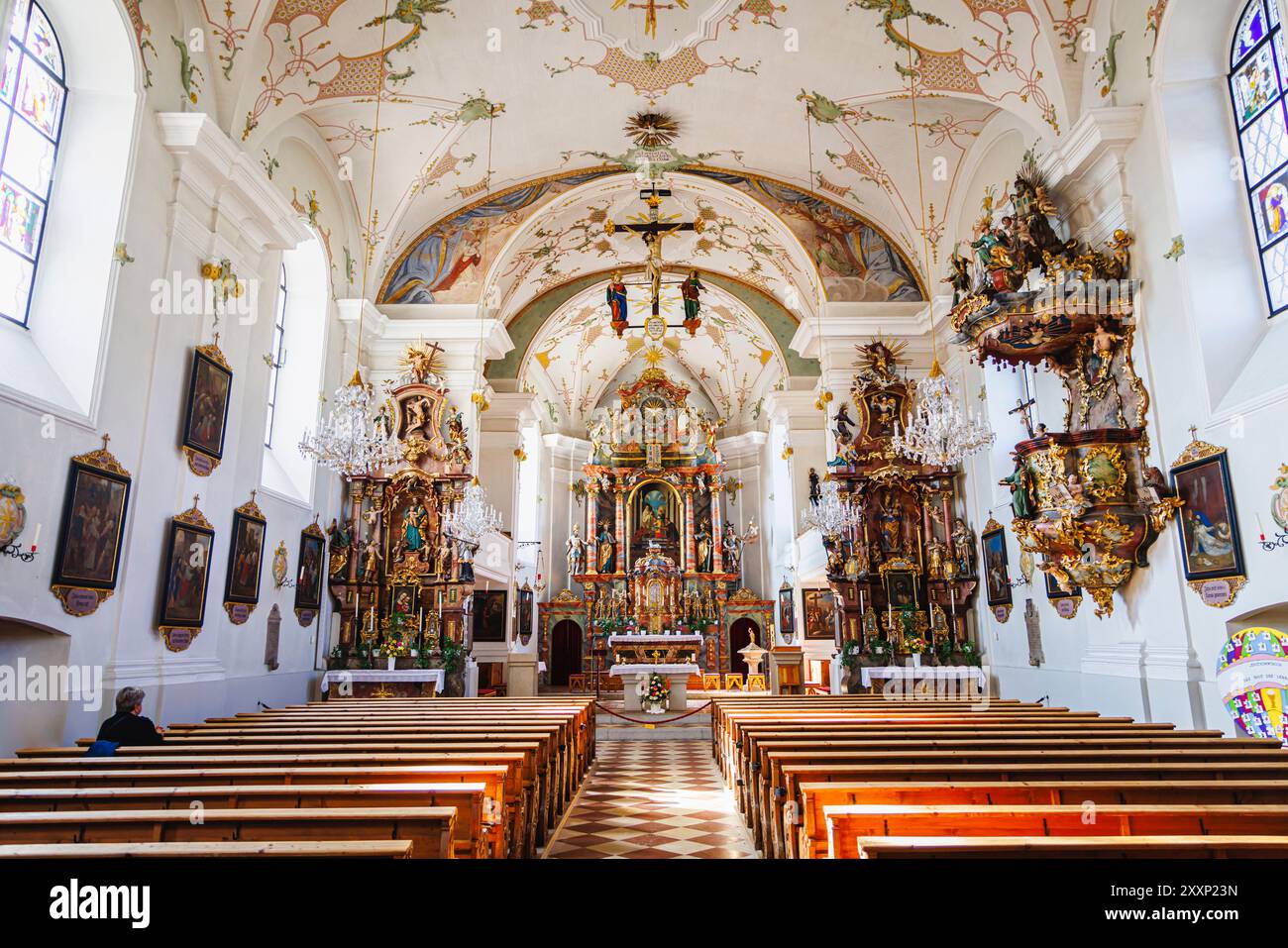 Nave, chancel and altar of Pfarrkirche St. Leonhard (parish church of St Leonard) in Mittersill, a village in the Pinzgau region of the Alps, Austria Stock Photo