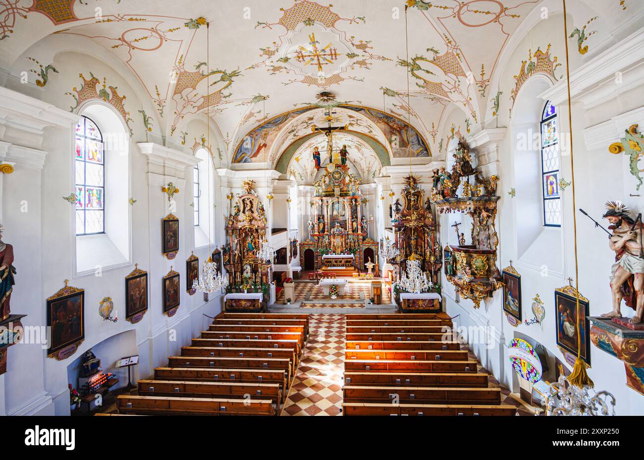 Nave, chancel and altar of Pfarrkirche St. Leonhard (parish church of St Leonard) in Mittersill, a village in the Pinzgau region of the Alps, Austria Stock Photo