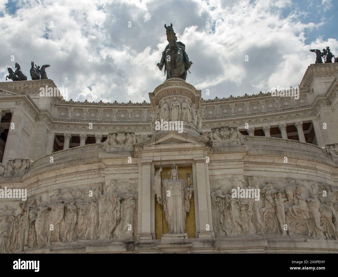 View of a monument decorated with sculptures in Rome under a cloudy sky ...