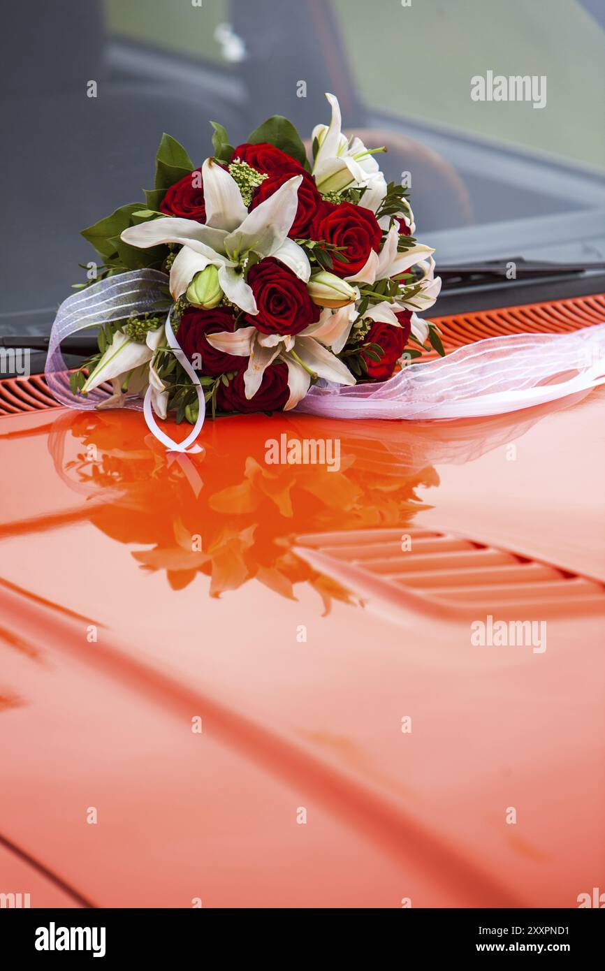 Bridal bouquet on a red bonnet Stock Photo - Alamy
