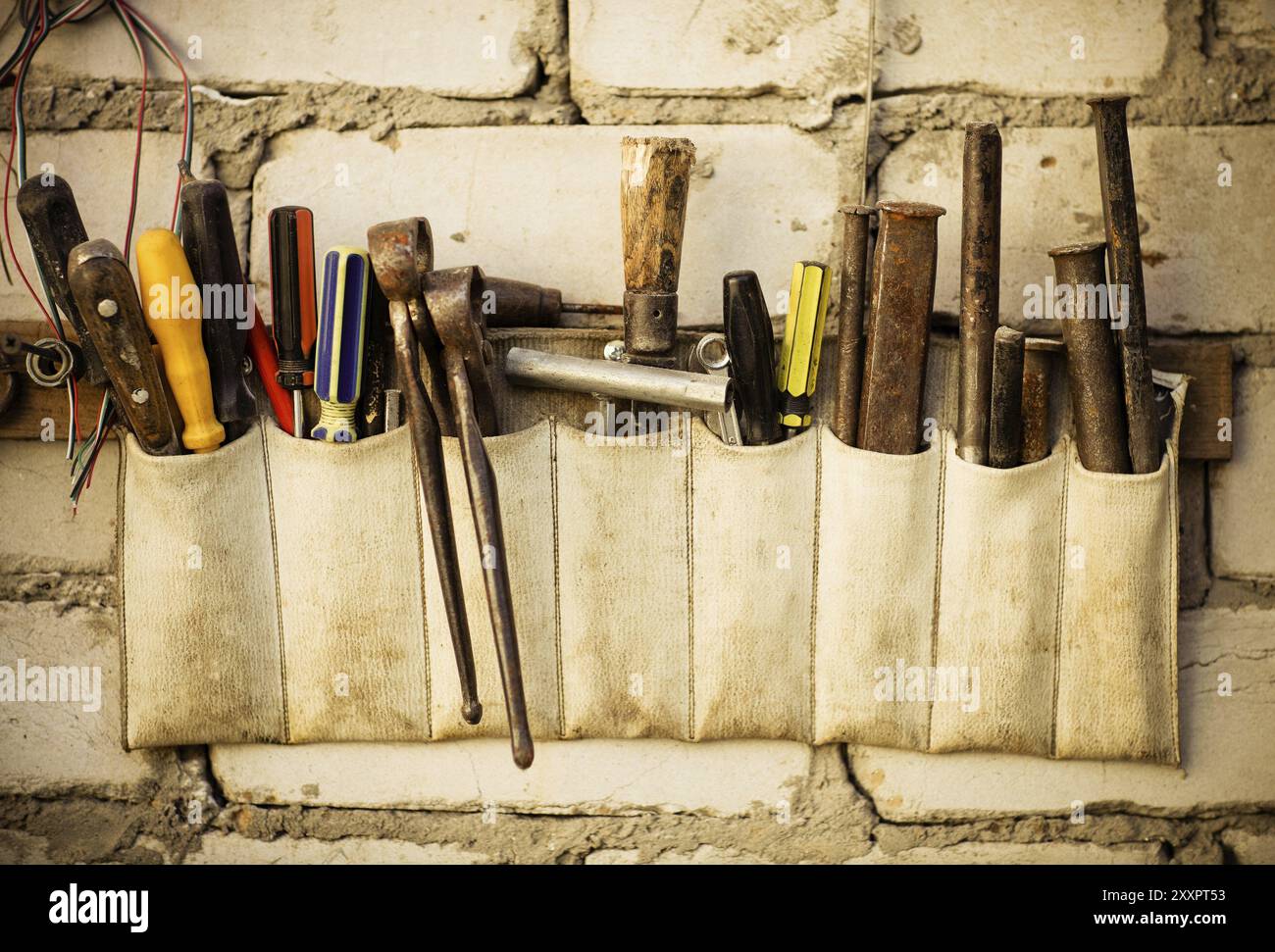 Tools renovation on grunge old brick wall. Close up Stock Photo