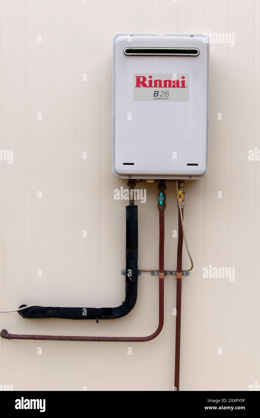 Outdoor gas hot water system mounted on wall, Western Australia Stock Photo
