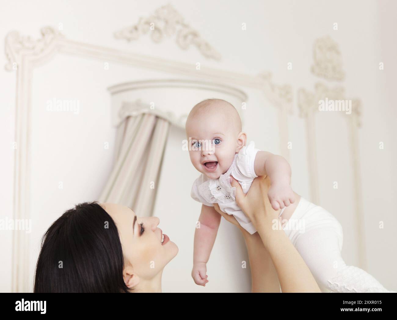 Happy Smiling Mother With Six Month Old Baby Girl Indoor Stock Photo Happy Smiling Mother With Six Month Old Baby Girl Indoor Stock Photo