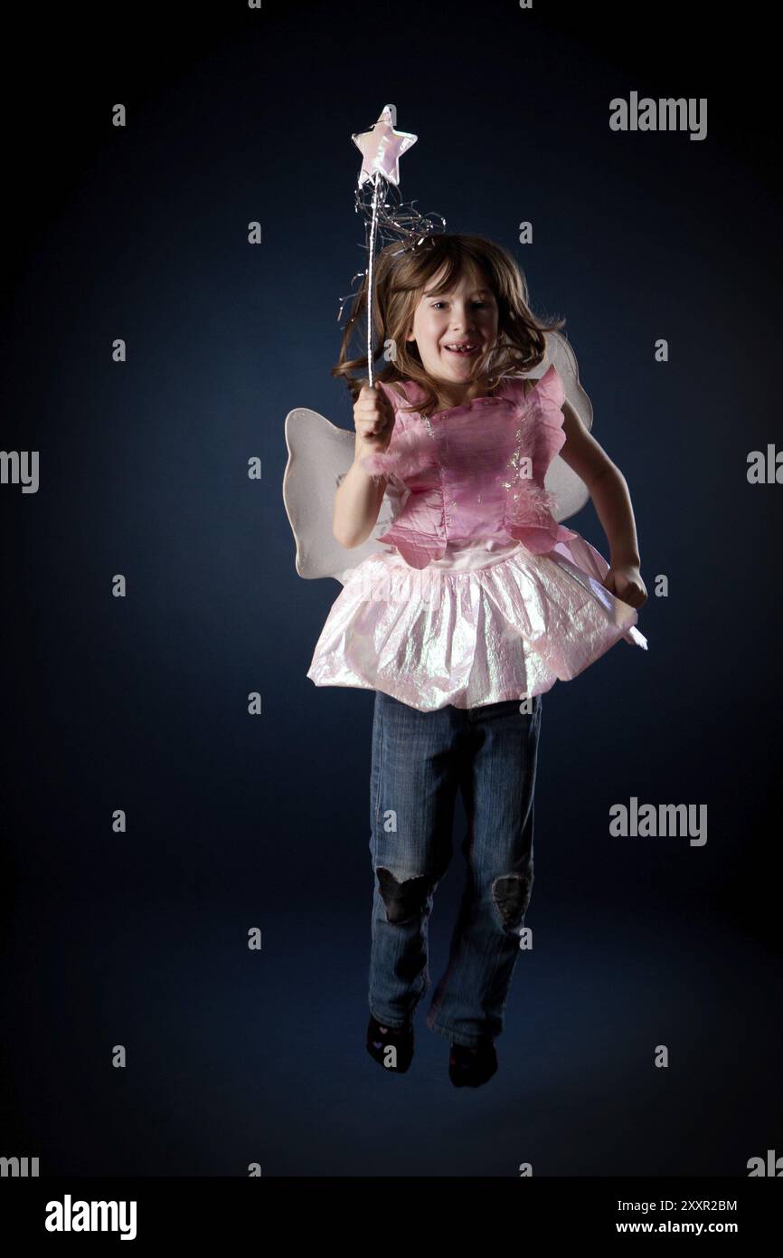 Little girl dressed up as a fairy with a magic wand Stock Photo - Alamy