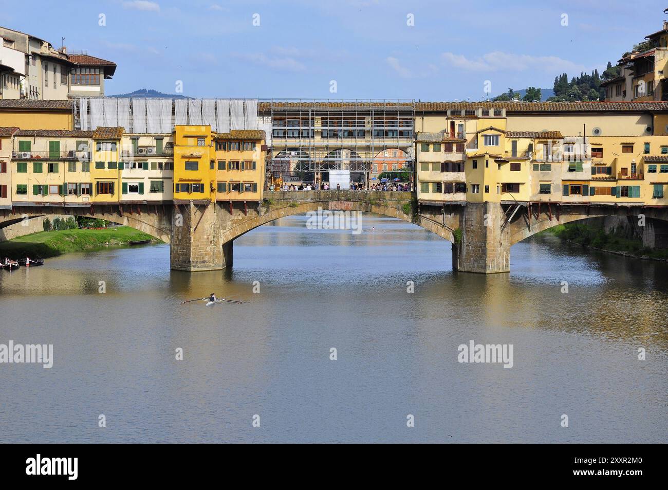 Vecchio Bridge's backside, Florence, Italy, with rower passing by ...