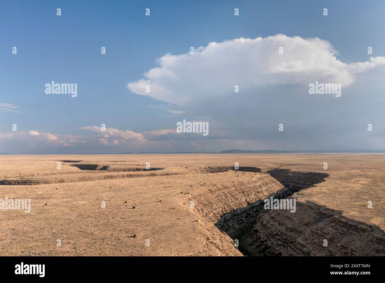 Storm clouds forming over deep desert crevice Stock Photo