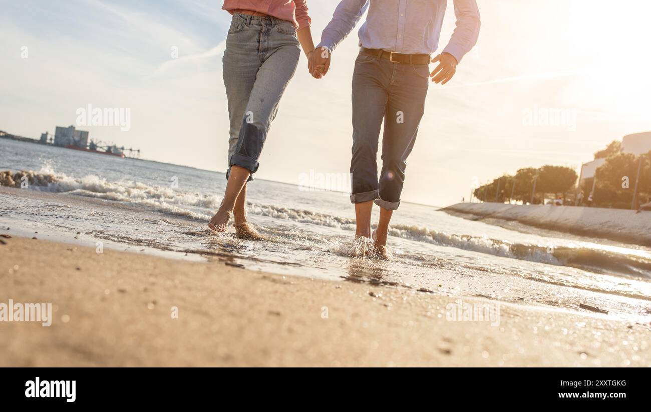 Walking hand in hand along the shore hi-res stock photography and ...