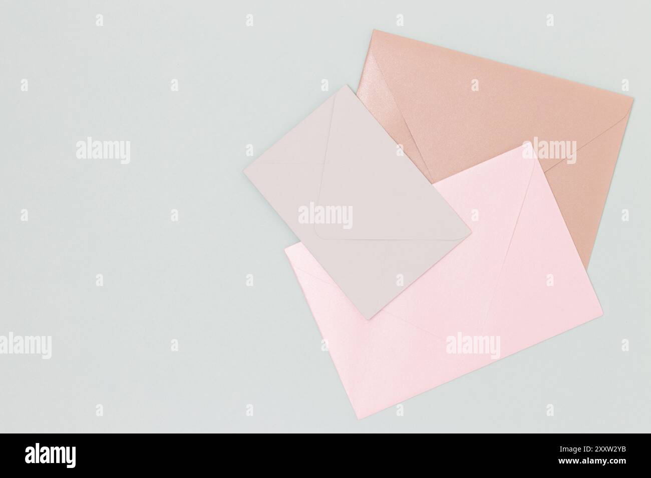 Multicolored envelopes on a blue background. Place for your design. Stock Photo