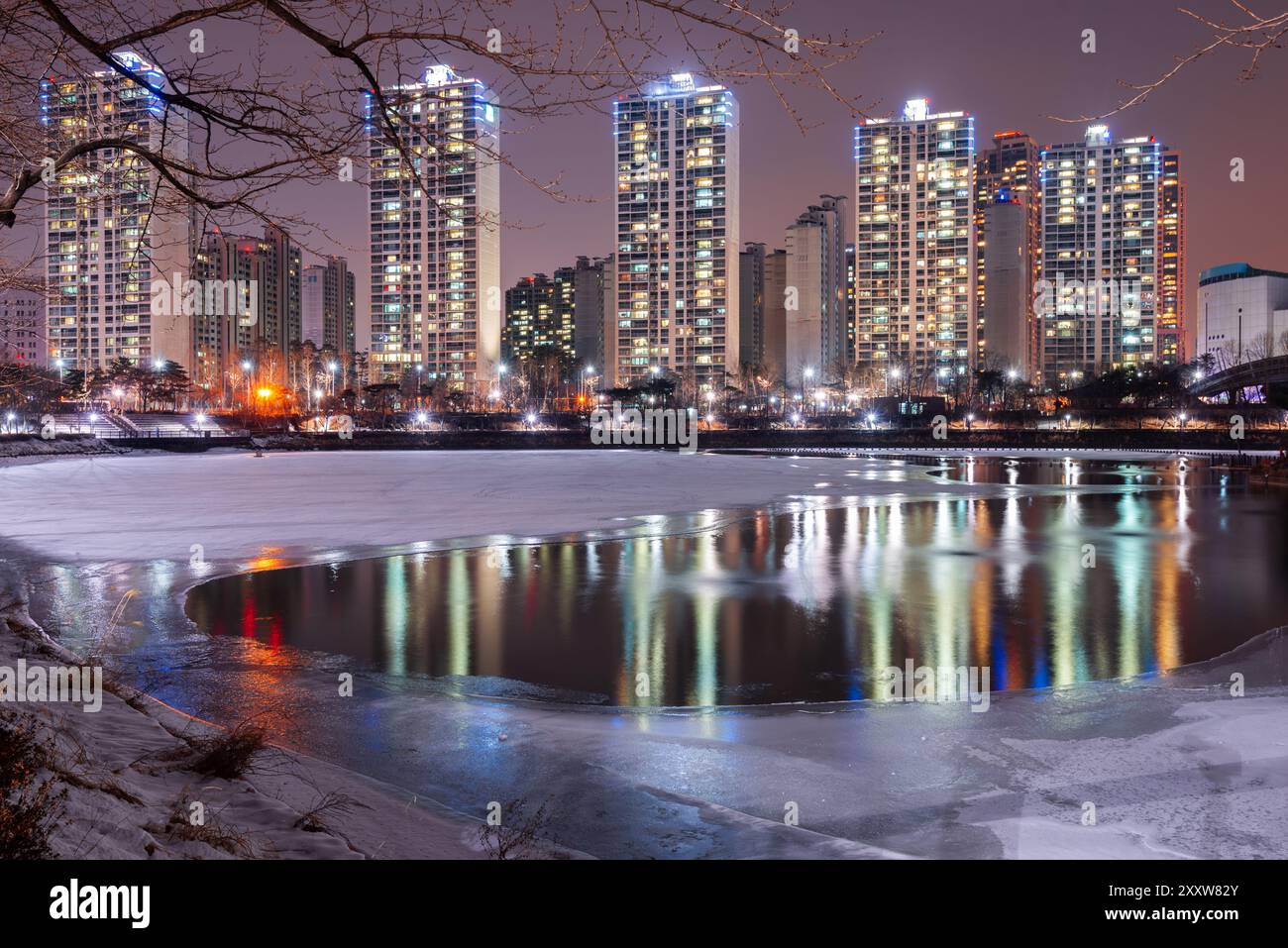 Seoul, South Korea winter pond and residential high rises ast night. Stock Photo