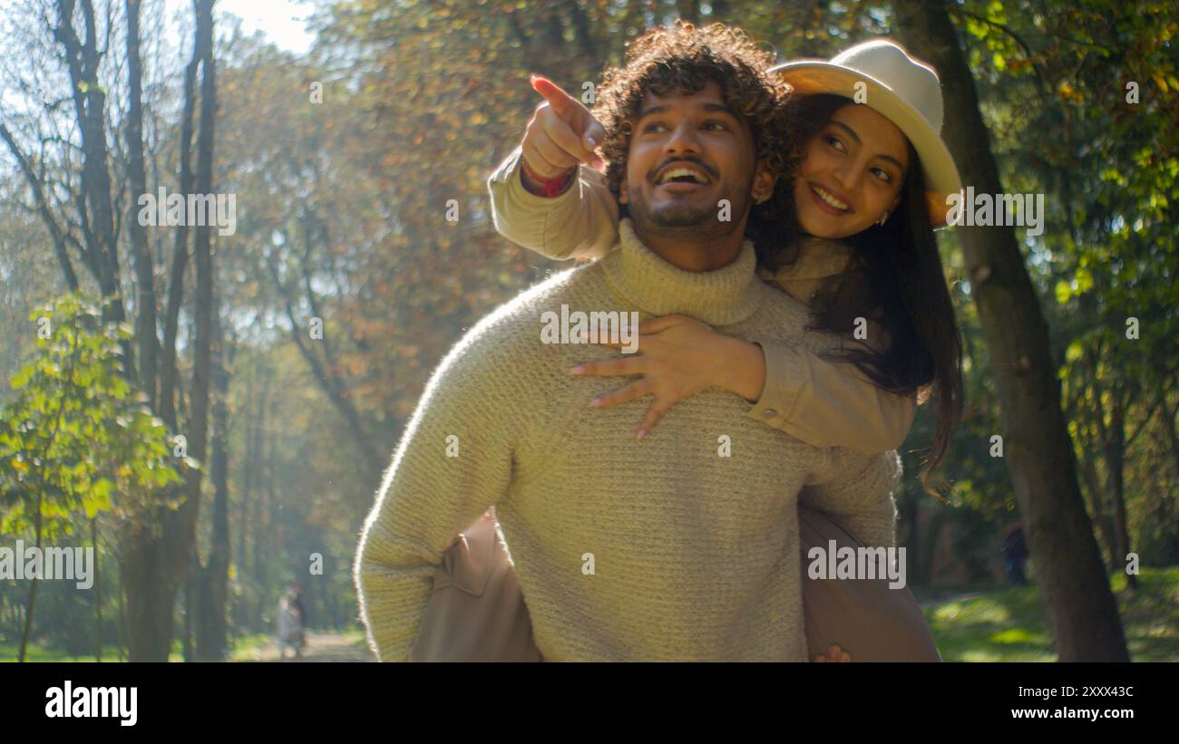 carefree-loving-indian-arabic-couple-smiling-man-boyfriend-boy-carry