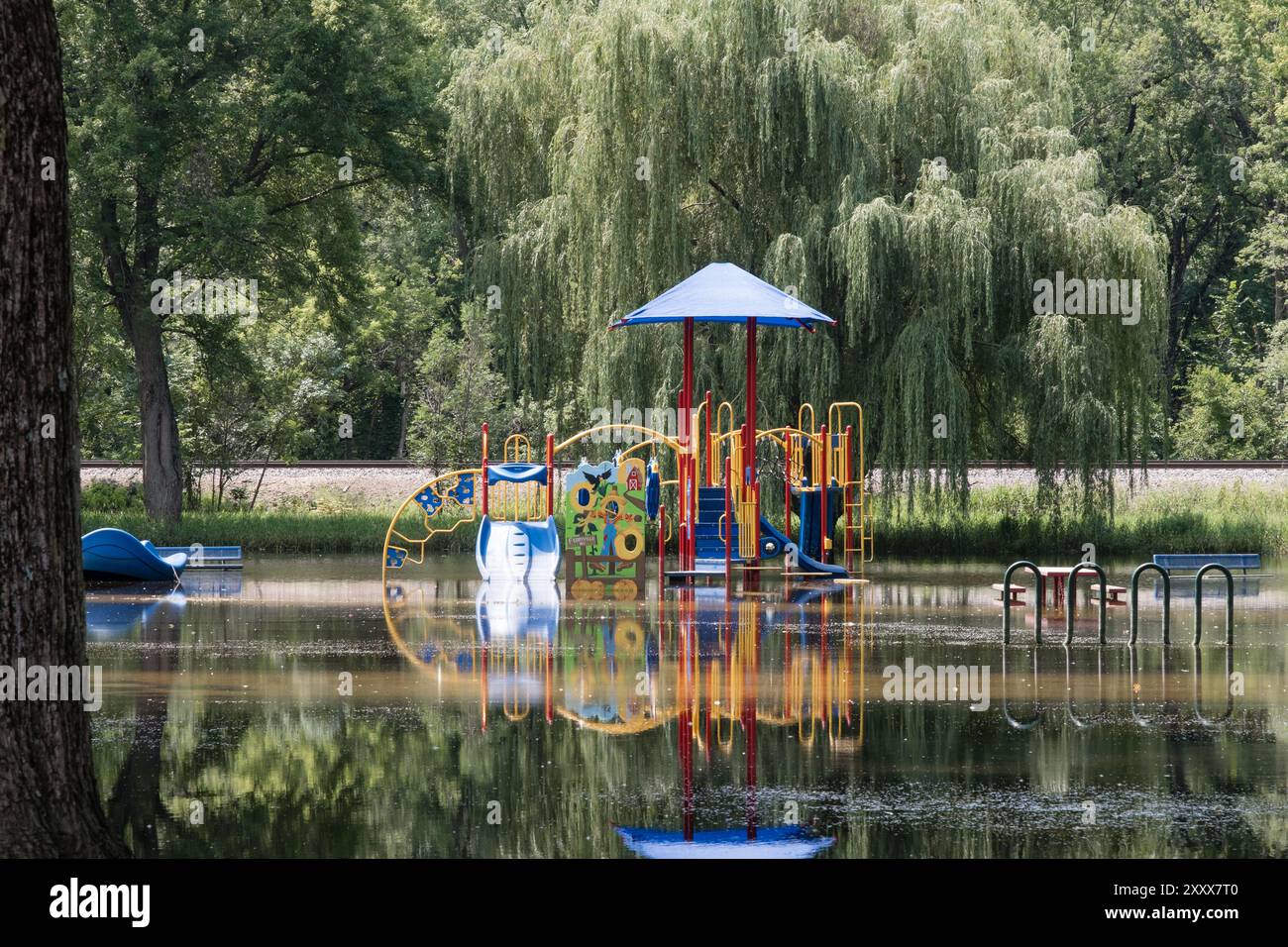 Playground structure in a flooded park. Stock Photo