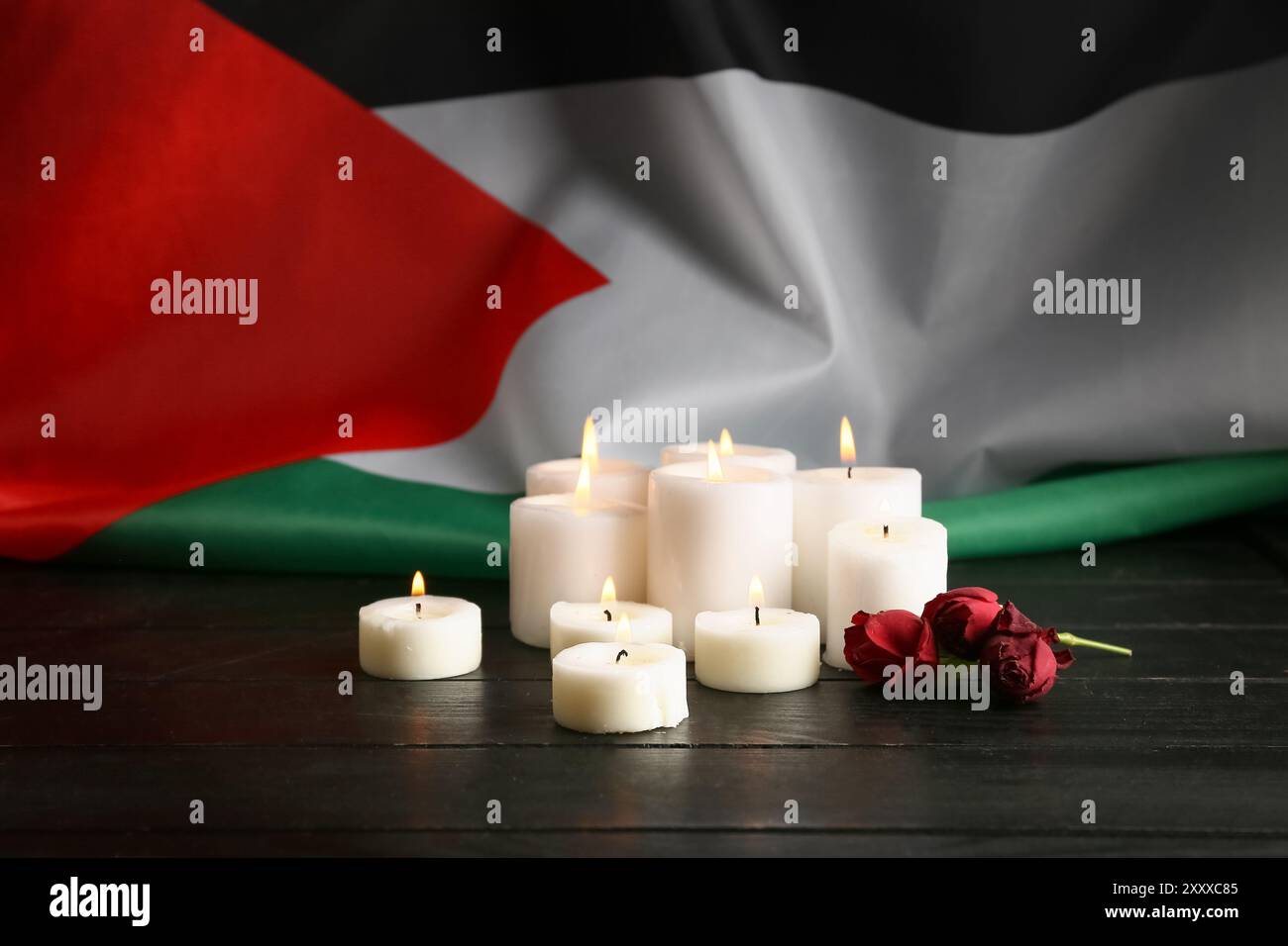 Palestinian Roses Flag of Palestine, rose flowers and burning candles on black wooden ...