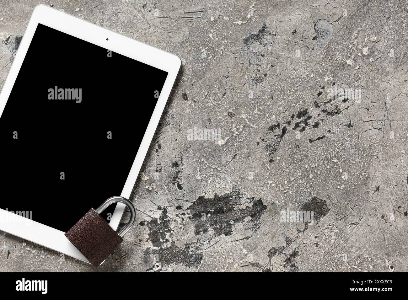 Padlock with tablet computer on grunge background. Cyber security concept Stock Photo