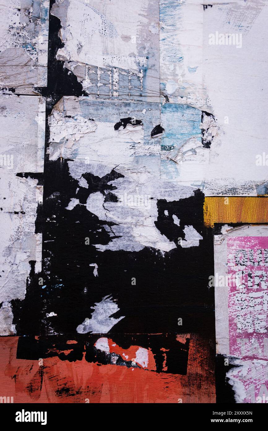 Wall with torn and pealing paper. Stock Photo