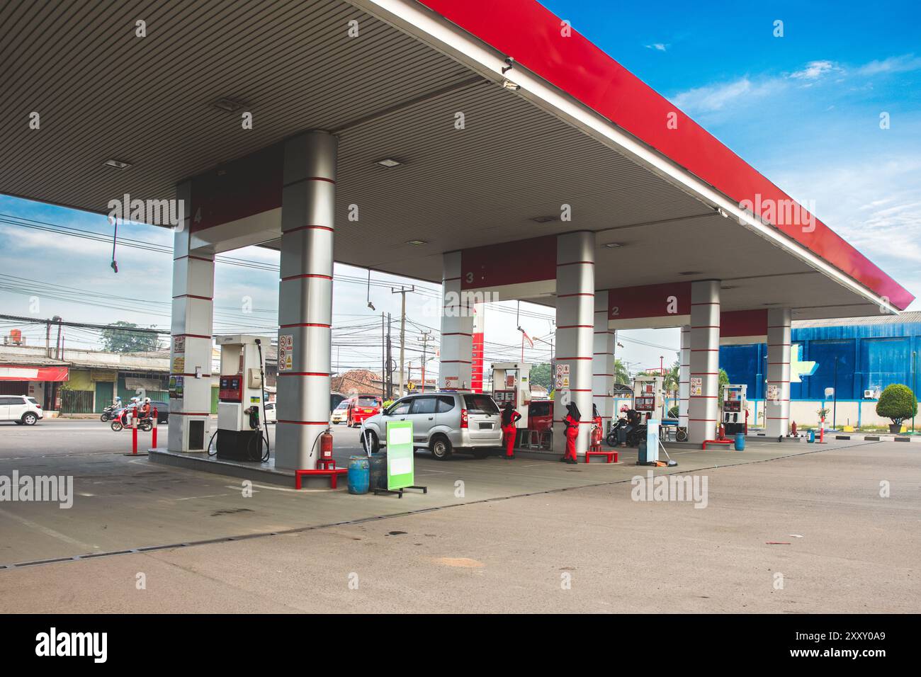 Gas station under the clear blue sky in Indonesia. Car refueling at gas