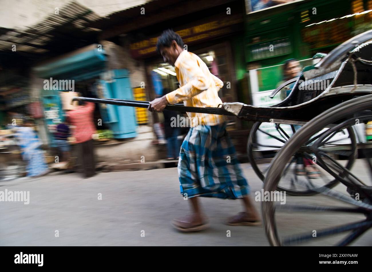 Hand pulled rickshaw in the streets of Kolkata. Stock Photo