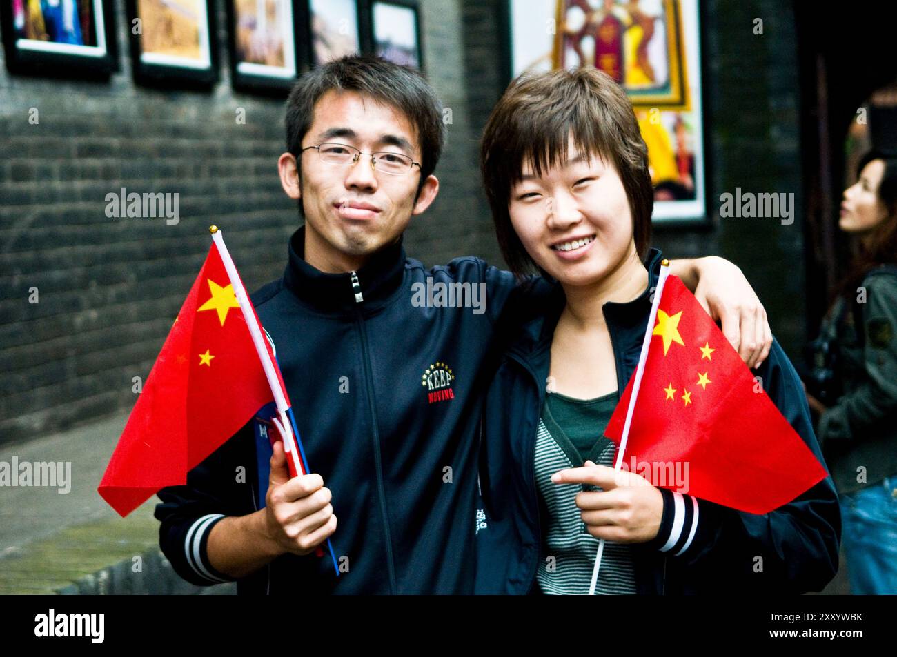 Chinese children sitting on a bicycle in the old town of Pingyao, China. Stock Photo