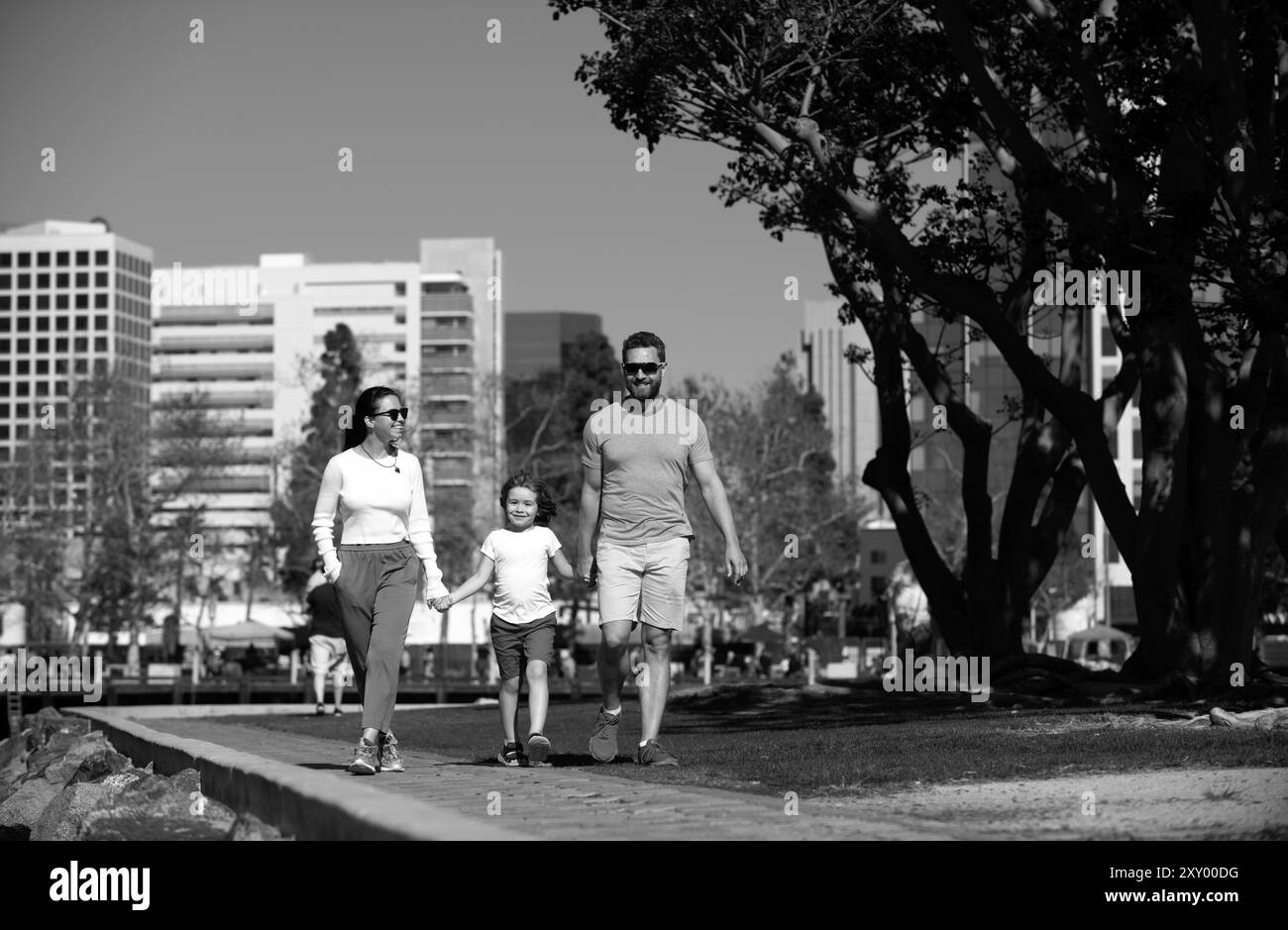 Happy american family walking the city street, casual lifestyle. Stock Photo