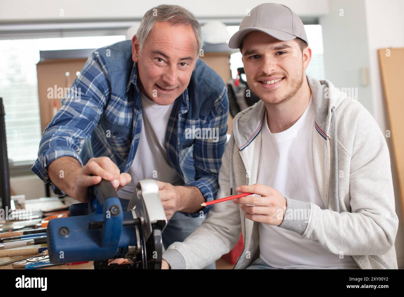 carpenter with apprentice in training period Stock Photo