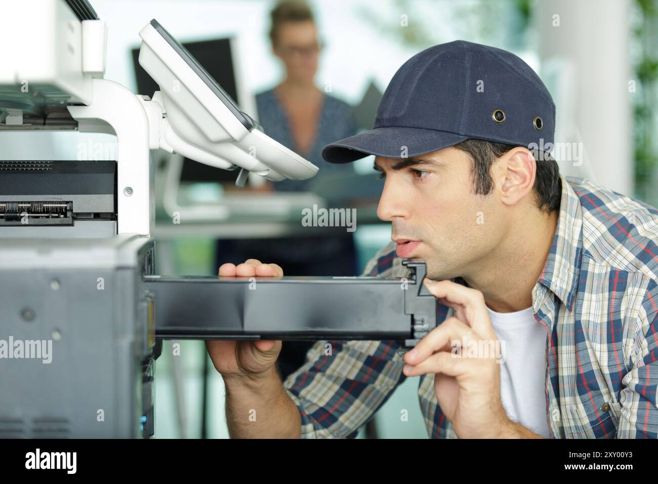 man working on professional printer Stock Photo - Alamy