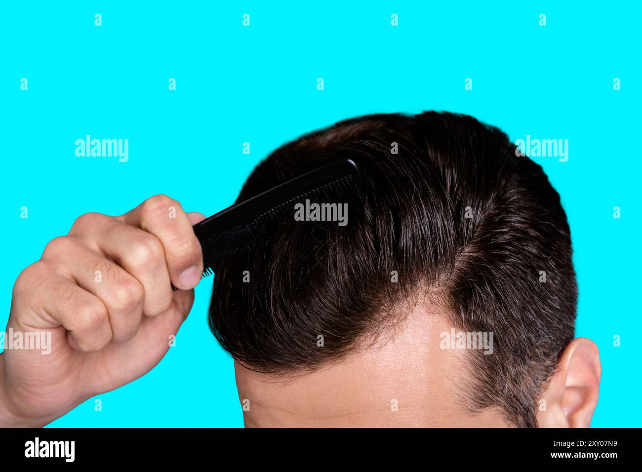 Cropped close up top above high angle photo amazing he him his macho hands arms plastic hair styling brush take care hairdo barber shop stylist visit Stock Photo