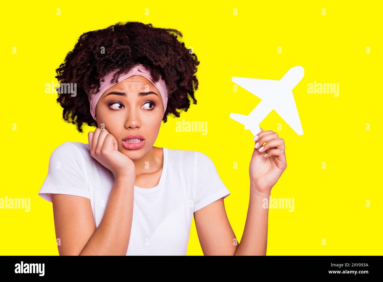 Close-up portrait of her she nice-looking shine charming cute attractive lovely afraid wavy-haired girl holding in hand plane phobia panic attack Stock Photo