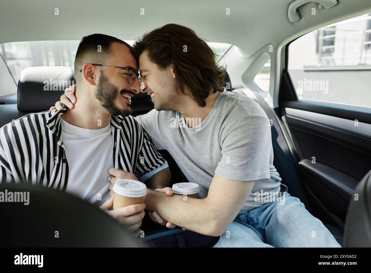 Two gay men holding other hi-res stock photography and images - Alamy