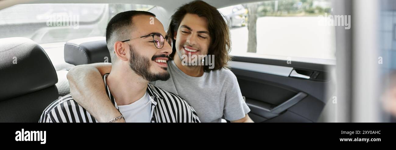 Two men, a gay couple, enjoy a moment together in the back seat of a ...