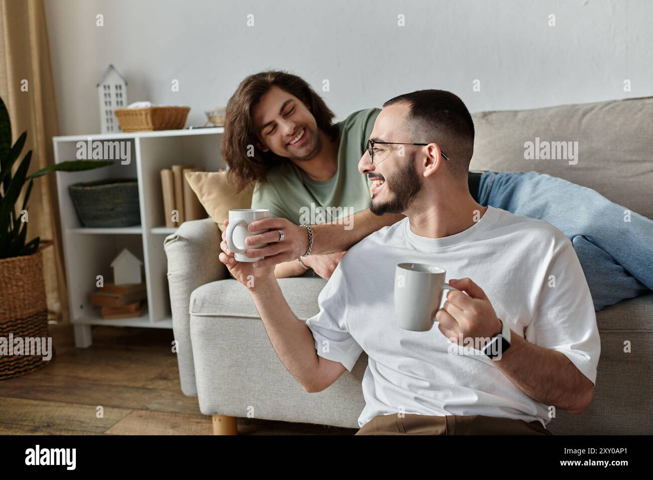 Two gay men holding other hi-res stock photography and images - Alamy