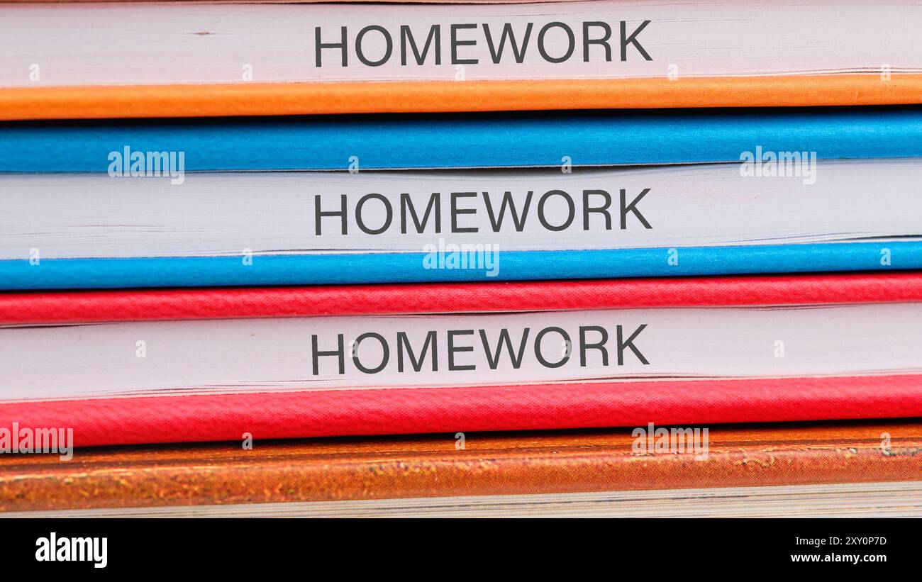 Notebook With Homework Word HOMEWORK on the ends of notebooks lying on top of each other Stock ...