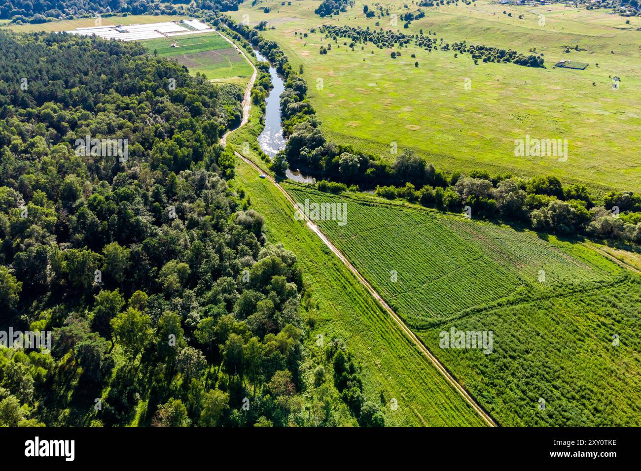 River bed passing by rural fields and forests, bird's eye view Stock ...