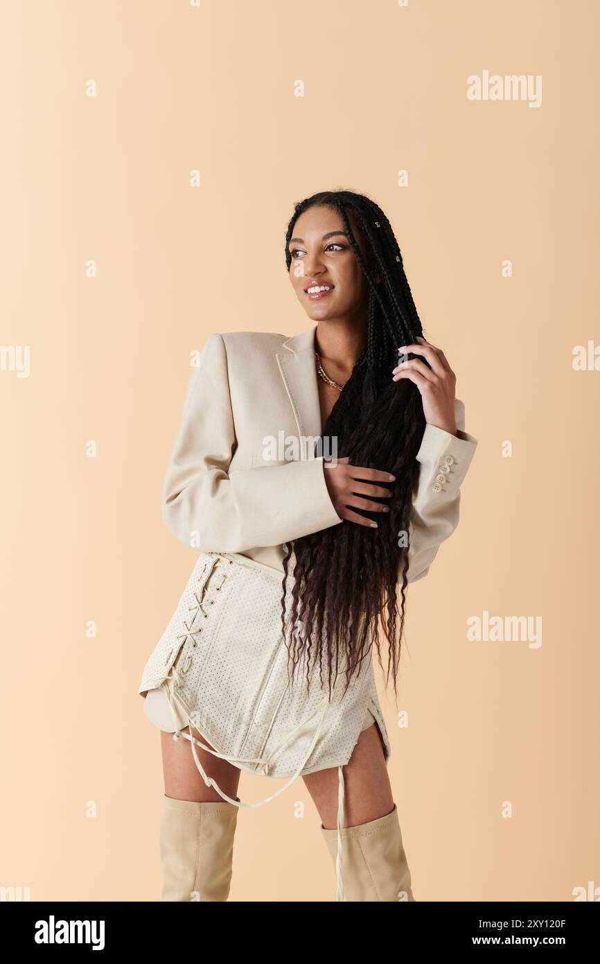 A young African American woman with long black hair poses confidently ...
