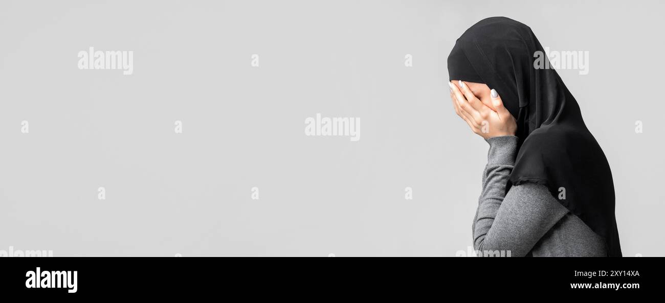Muslim woman hiding face hands hi-res stock photography and images - Alamy
