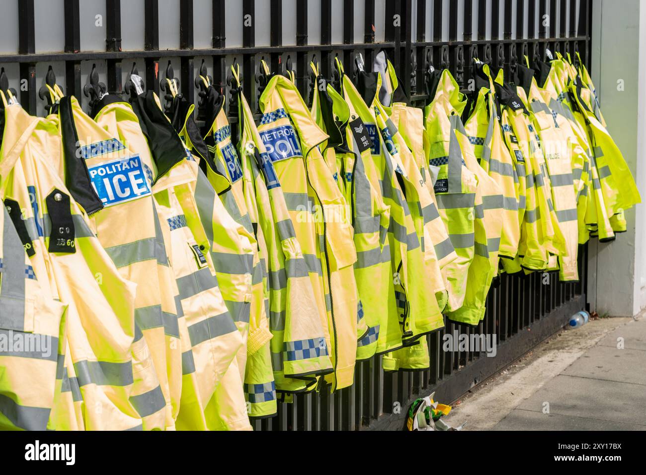 Police jackets hanging from a fence during Notting Hill Carnival Grand