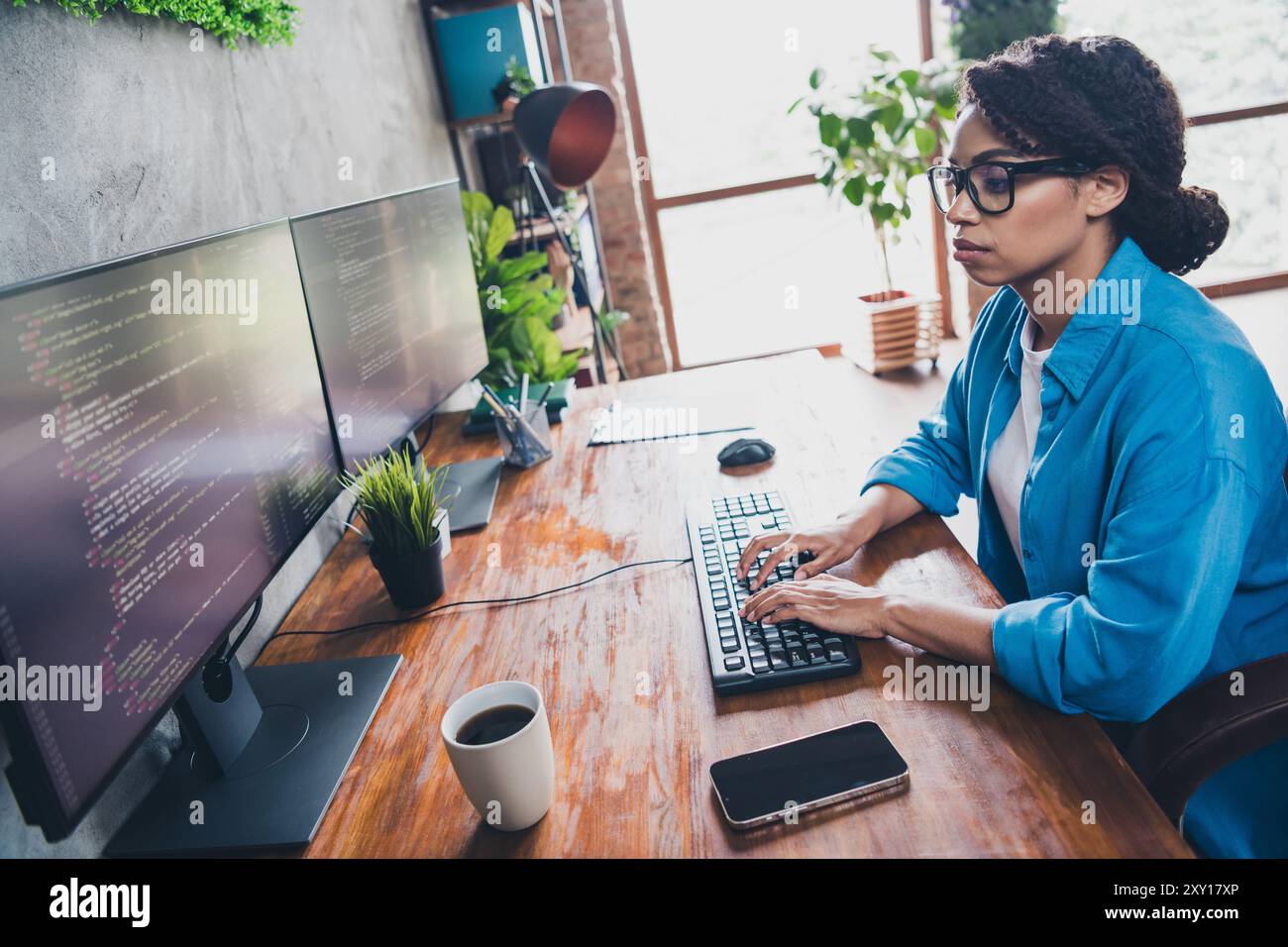 Photo of attractive young woman typing keyboard coding wear blue shirt ...