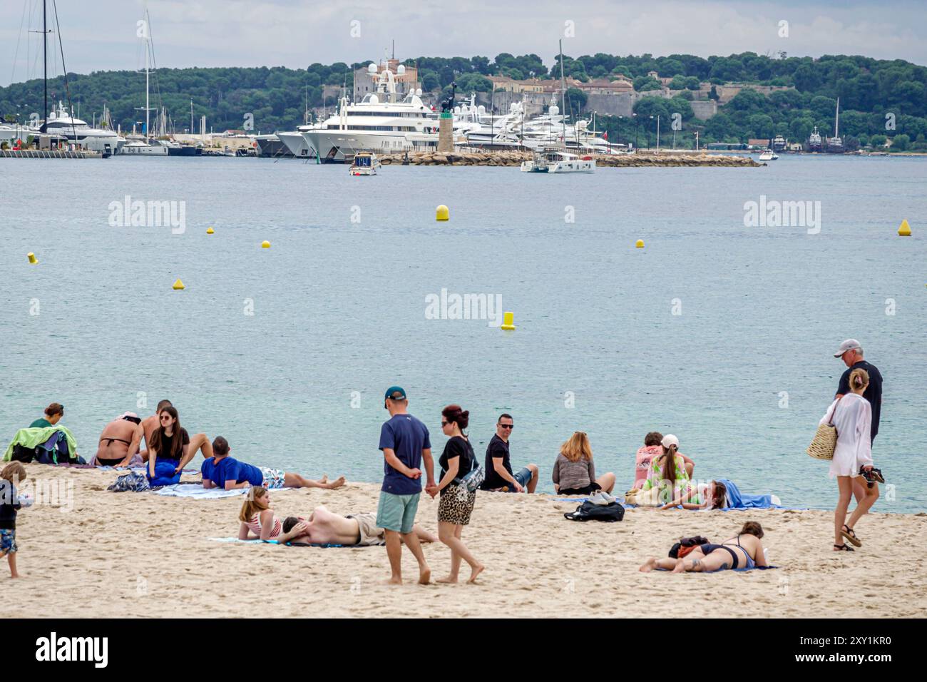 Cannes France,French Riviera,Cote d'Azur,Plage Mace,Croisette Beach Cannes,men women couples,relaxing sunbathing,French Europe European EU,visitors tr Stock Photo