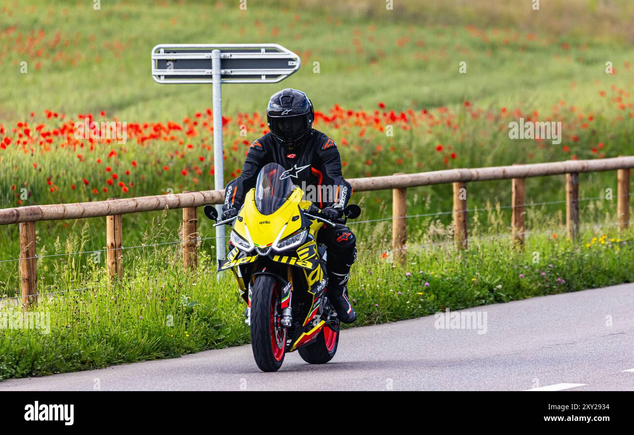 Oberglatt, Switzerland, 5th Jun 2024: A motorcyclist rides his two-wheeler on a street outside the canton of Zurich. (Photo by Andreas Haas/dieBildman Stock Photo