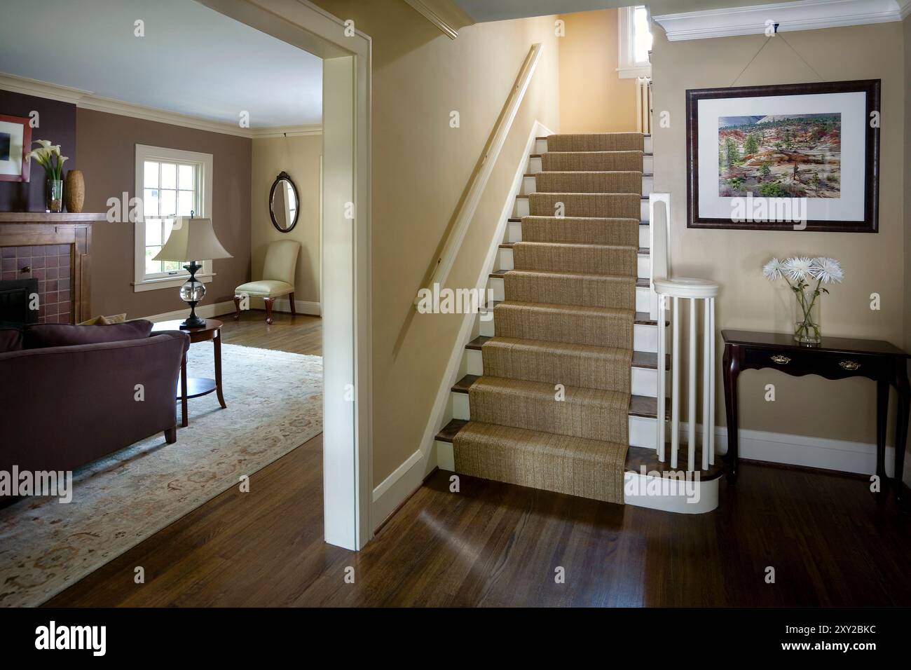 Entrance Hallway To Traditional Home Showing Stairwell And Living Room