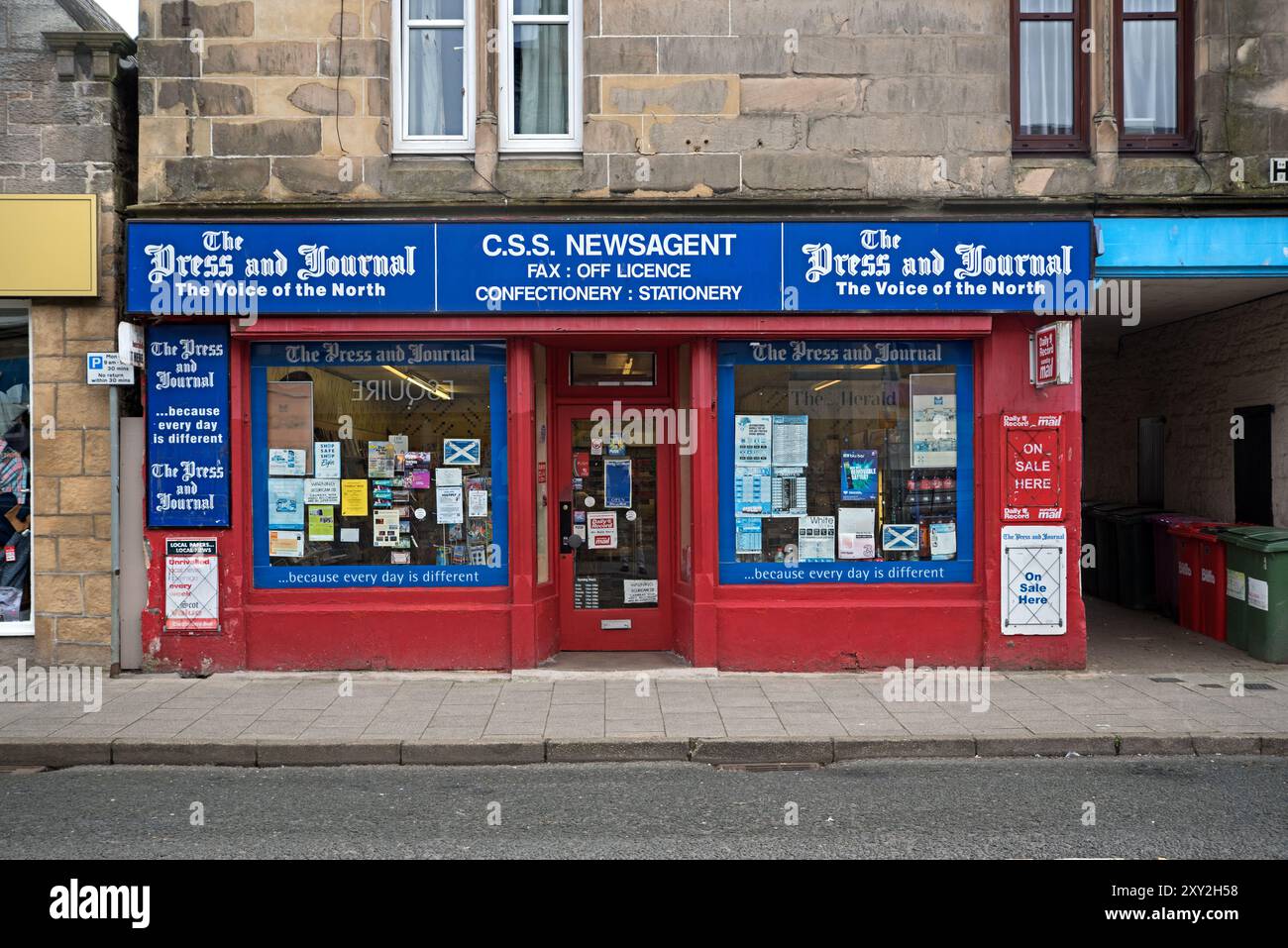 Newsagents Sign Exterior view of a traditional newsagents shop on the High Street in ...