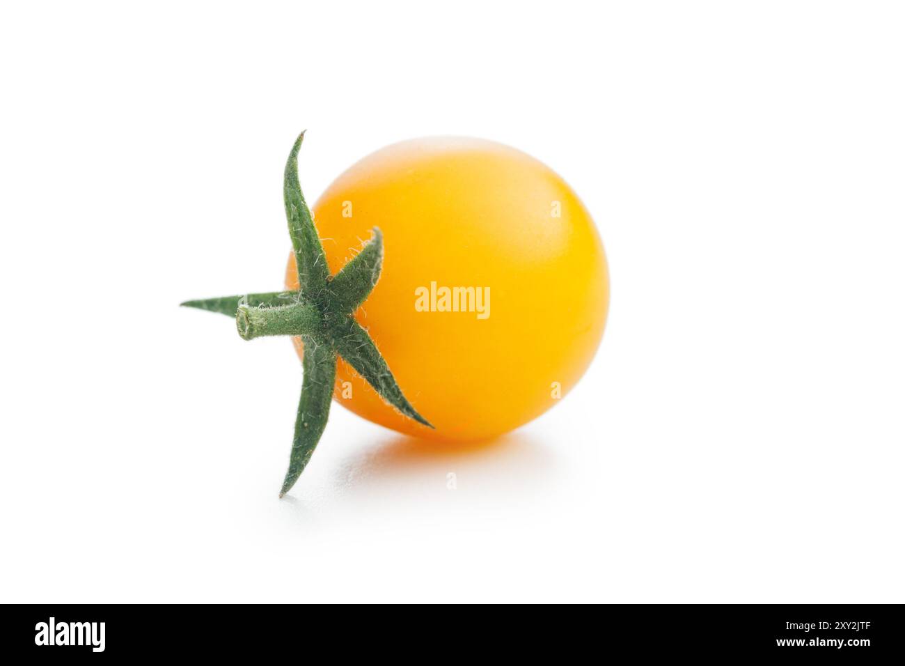 Yellow cherry tomatoes isolated on a white background. Stock Photo