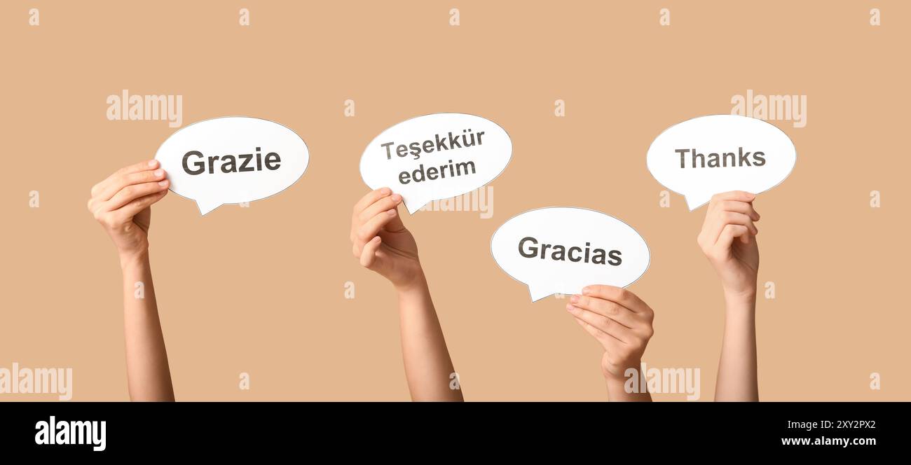Hands holding speech bubbles with text THANK YOU in different languages ...